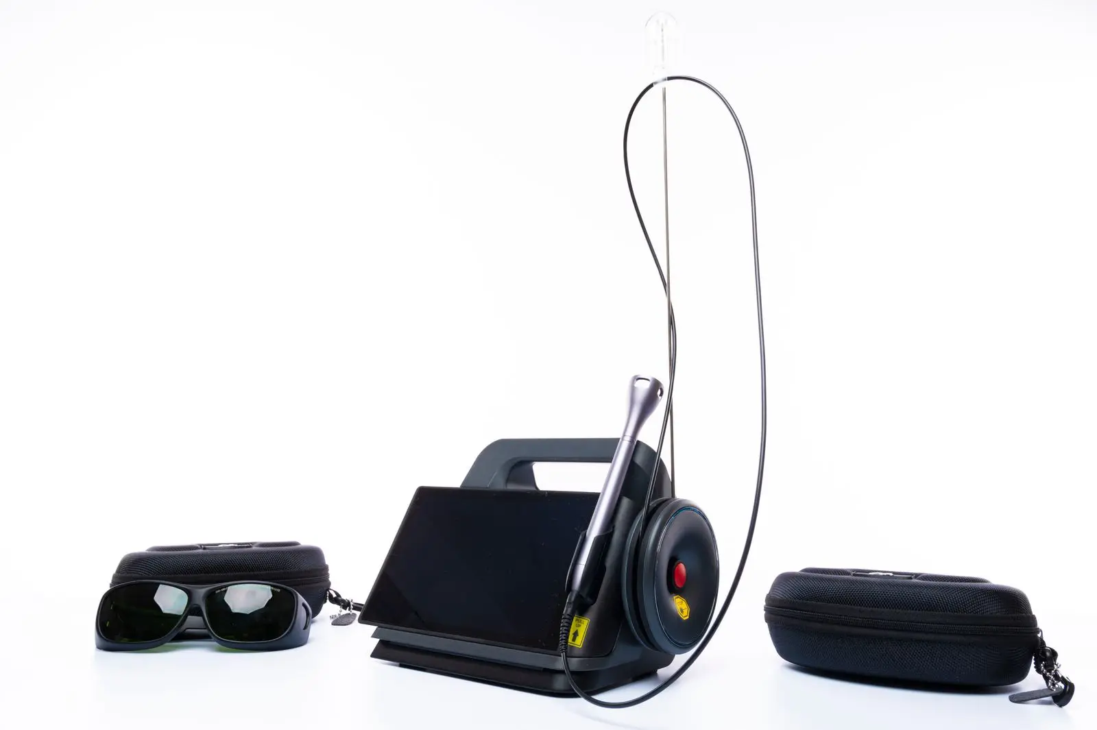 Dental laser unit with handpiece, protective goggles and carrying cases